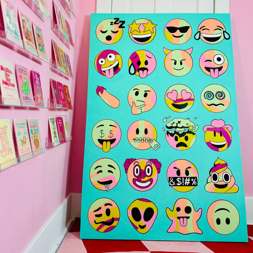 Colorful emoji canvas painting on a pink wall with more posters in the background.