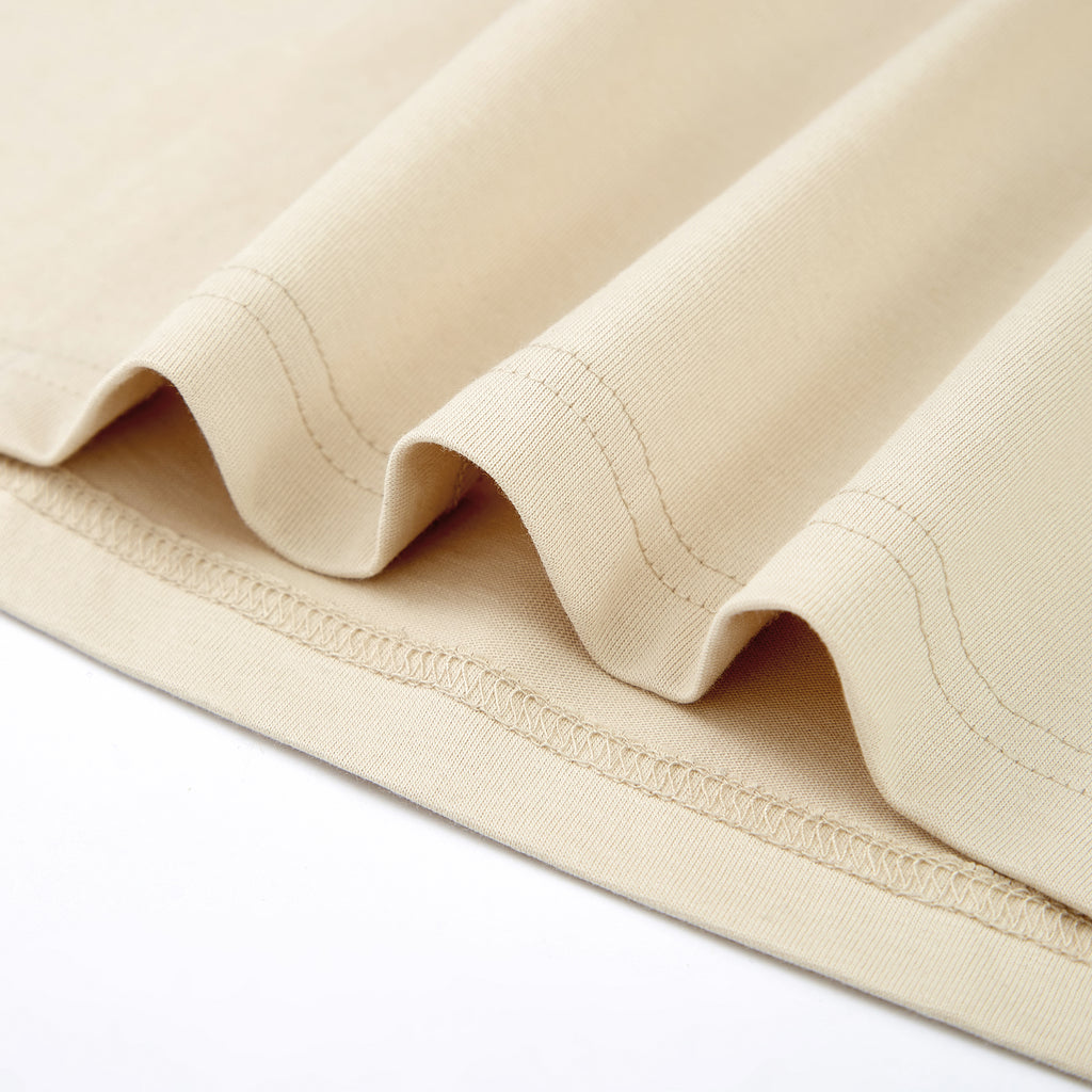 Close-up of beige fabric with a white background