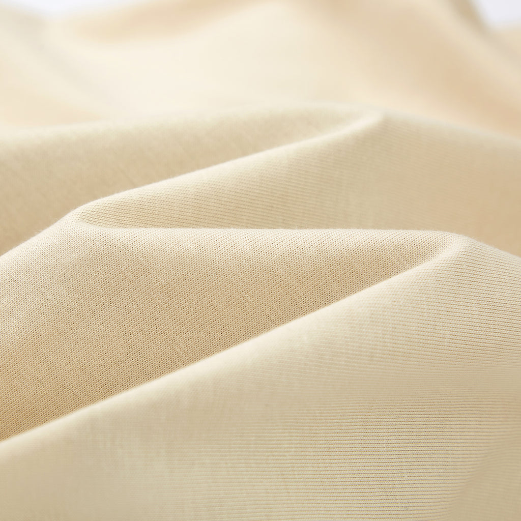 Close-up of beige fabric with a subtle texture